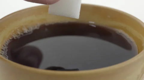 Sugar cube soaked in coffee. 4K UHD Stock Footage 48926709