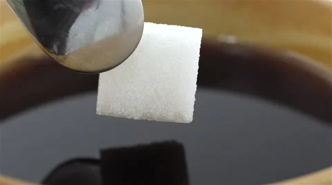 Sugar cube soaked in coffee. Slow Motion 스톡 동영상 48928194