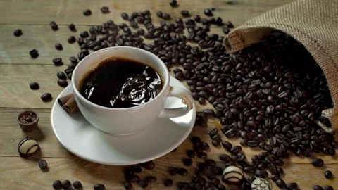 Sugar Cube Splashing in Hot Black Coffee in Slow Motion Stock Footage 141456438