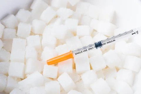 Sugar cube texture background sweet food ingredient and syringe Stock Photos