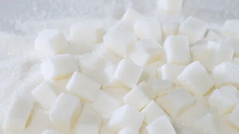 Sugar cubes are on a table on granulated sugar Stock Footage 178453588