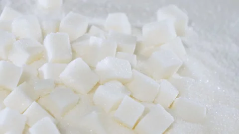 Sugar cubes are on a table on granulated sugar Stock Footage 178454886