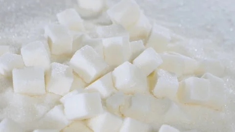 Sugar cubes are on a table on granulated sugar Stock Footage 178455928