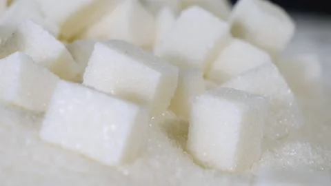 Sugar cubes are on a table on granulated sugar Stock Footage 178456701