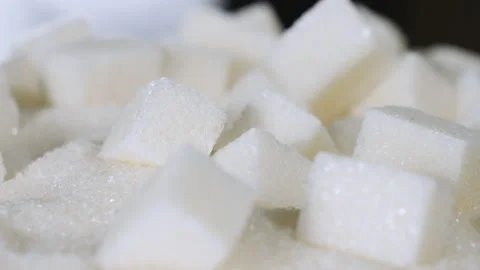 Sugar cubes are on a table on granulated sugar Stock Footage 178459451