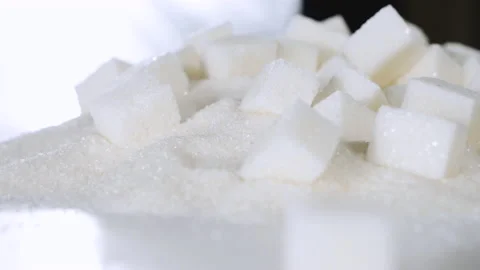 Sugar cubes are on a table on granulated sugar Stock Footage 178459683