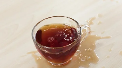 Sugar Cubes Dropping and Splashing into Glass Cup of Black Tea Stock Footage 345784157