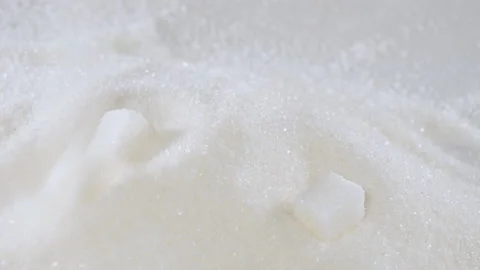 Sugar cubes fall on granulated sugar close-up 스톡 동영상 178452849