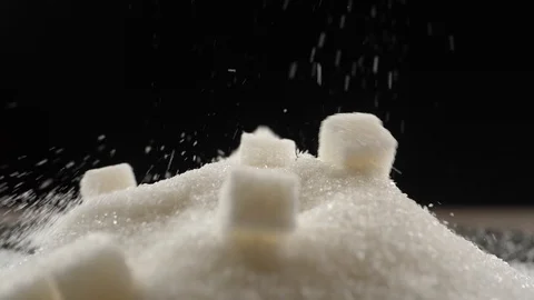 Sugar cubes fall on a pile of sugar Video stock 109800347