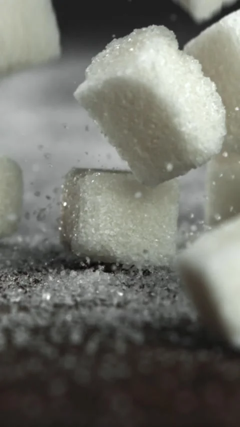 Sugar cubes fall on the table. Filmed on a high-speed camera at 1000 fps Stock Footage 335370587