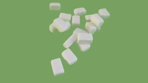 Sugar cubes falling down on the green screen Stock Footage 293689753
