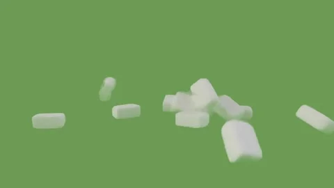Sugar cubes falling down on the green screen Stock Footage 293689755