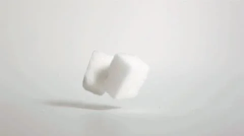 Sugar cubes falling down in super slow motion Stock Footage 10814680