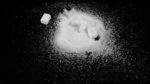 Sugar cubes falling on the heap of refined white sugar on the black background Stock Footage 293689724