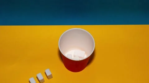 Sugar cubes going into coffee cup. Stop motion creative concept. Stock Footage 266049338