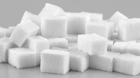 Sugar cubes on the gray table Vídeos de archivo 288858404