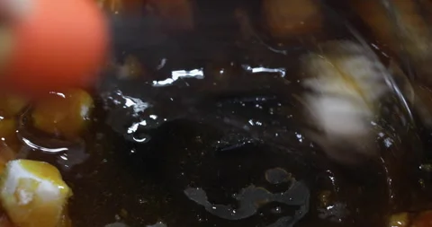 Sugar cubes melting and caramelizing in hot pan Stock Footage 329030631