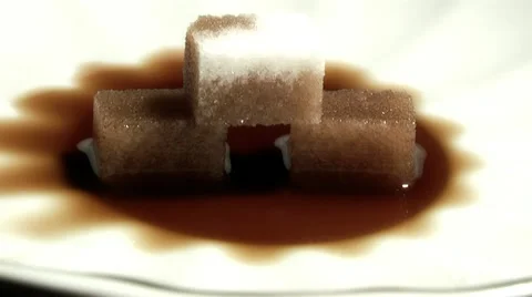 Sugar cubes melting in tea Stock Footage 11290181