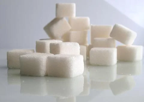 Sugar cubes over white background Stockfoto's