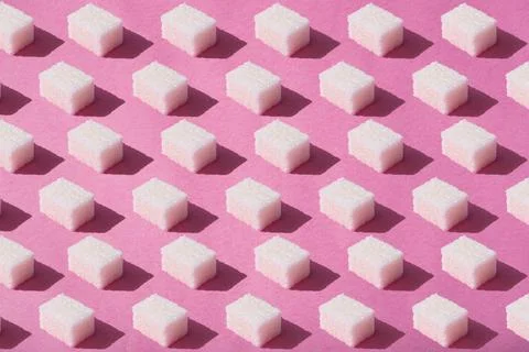 Sugar cubes pattern on pink background. Abstract, minimal style. Stock Photos