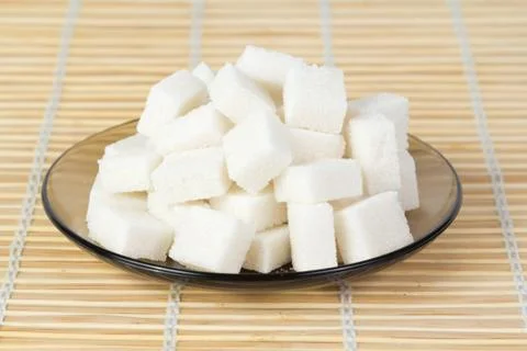 Sugar cubes on a plate Stock Photos