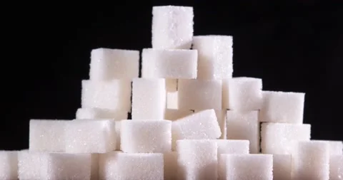 Sugar cubes rotate on black background. Stock Footage 150900392
