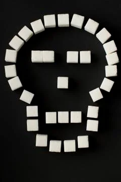 Sugar cubes in a shape of scull  Stock Photos
