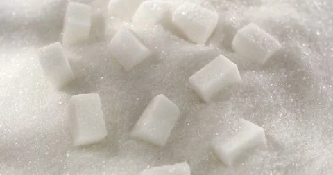 Sugar Cubes on the Surface of White Sugar. Macro shot. Close up. Slow motion. Stock Footage 242421382