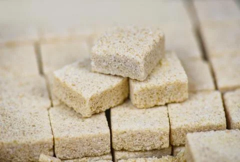 Sugar cubes on table background - Close up of brown sugar stacked in box 写真素材