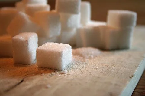 Sugar cubes on table Stock Photos