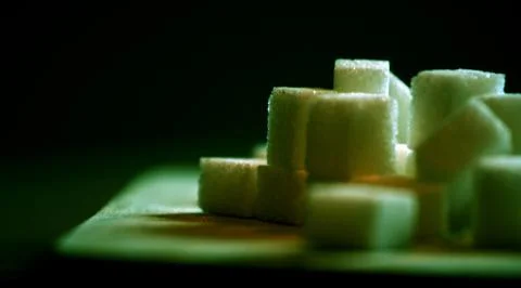 Sugar cubes on table Stock Photos