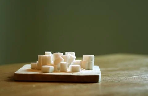 Sugar cubes on table Stock Photos