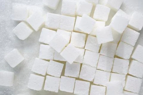 Sugar cubes on white background Stock Photos