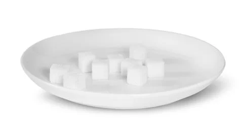 Sugar cubes on a white plate Stock Photos