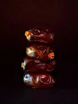 Sugar dates close-up on a black background. Stock Photos