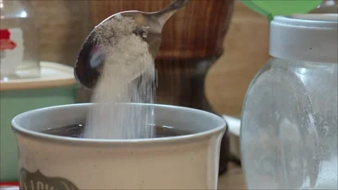 Sugar dissolving while stirring hot beverage Stock-Footage 307496050