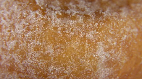 Sugar Doughnut Rotating _ loopable macro close up of detail and texture. Stock Footage 60951853