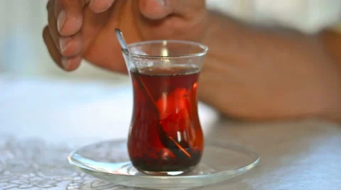 Sugar Droping In To Tea And Mixing It With Spoon Video stock 65510797