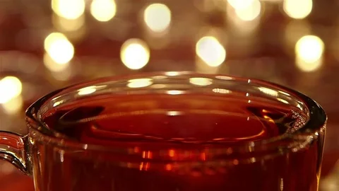 Sugar drops into hot black tea in closeups. Slow motion Stock Footage 73636807
