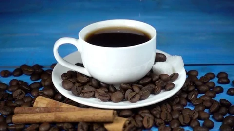 Sugar fall into a cup of coffee in a slow motion Stock Footage 84845428