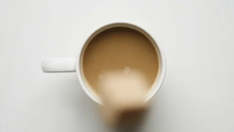 Sugar falling into coffee cup 스톡 동영상 120119456