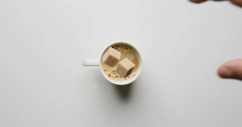 Sugar falling into coffee cup 스톡 동영상 120119614