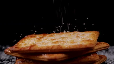 Sugar falling into cracker in slow motion Stock-Footage 133174340
