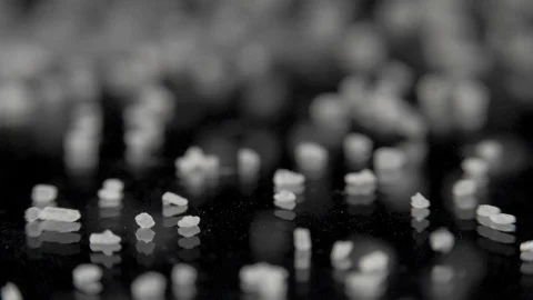 Sugar falling on the table in dark studio. Slowmotion, 180 fps shot Stock Footage 86284199