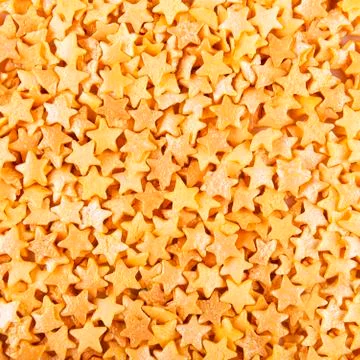Sugar gold asterisks background Stock Photos