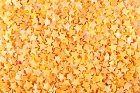 Sugar gold asterisks background Stock Photos