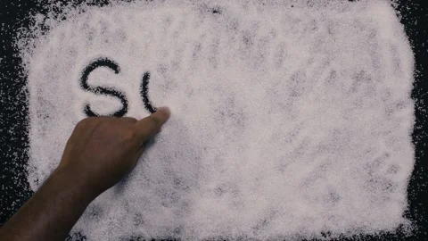 Sugar Kills written in sugar on the table Stock Footage 248782677