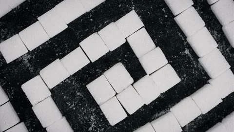 Sugar Labyrinth Many Sugar Cubes in Maze Shape Rotates on Black Background Stock Footage 261889723
