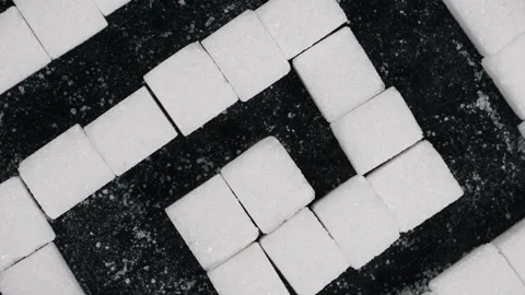 Sugar Labyrinth Many Sugar Cubes in Maze Shape Rotates on Black Background Stock Footage 263440286