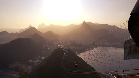 Sugar loaf cable car passing in the sunset in Rio de Janeiro, Brazil Stock Footage 125055710
